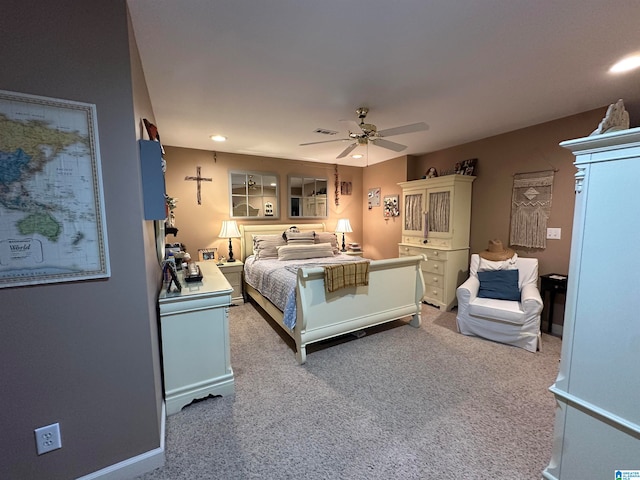 bedroom featuring light carpet and ceiling fan