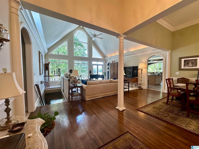 living room with crown molding, ornate columns, high vaulted ceiling, hardwood / wood-style flooring, and ceiling fan