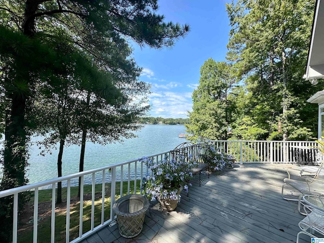 wooden terrace featuring a water view