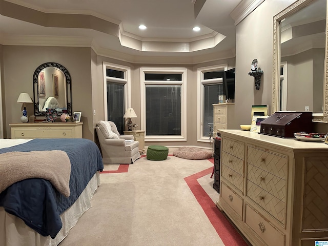 bedroom with ornamental molding, carpet flooring, and a raised ceiling