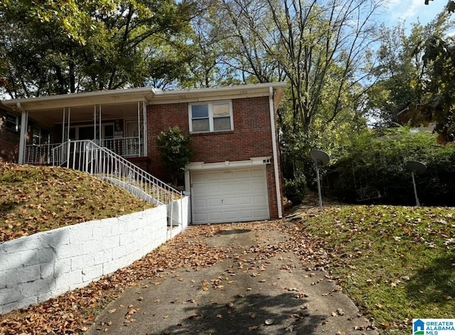 view of front facade featuring a porch and a garage