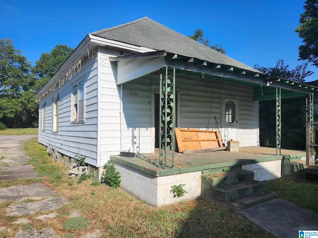 view of home's exterior featuring a porch