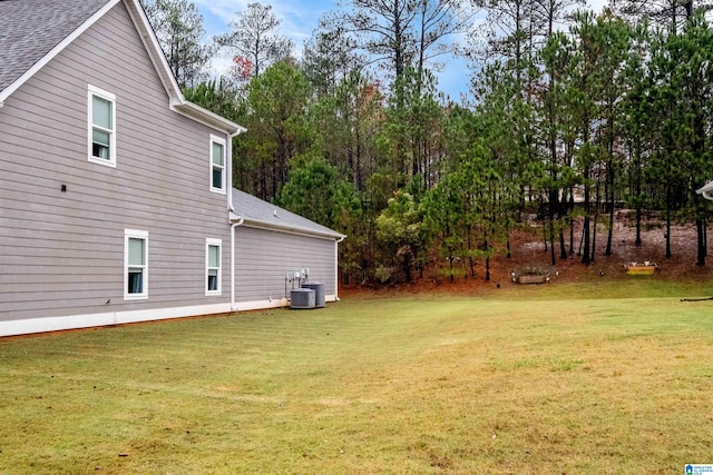 view of yard featuring central air condition unit