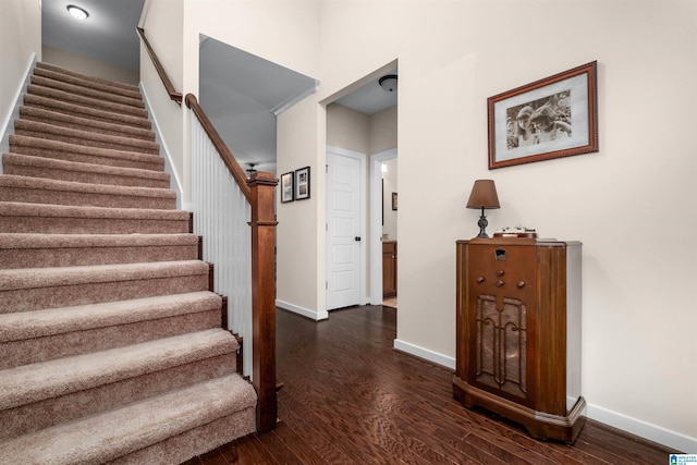 staircase featuring hardwood / wood-style flooring