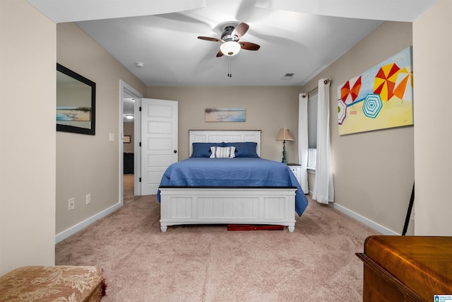 bedroom featuring ceiling fan and light colored carpet