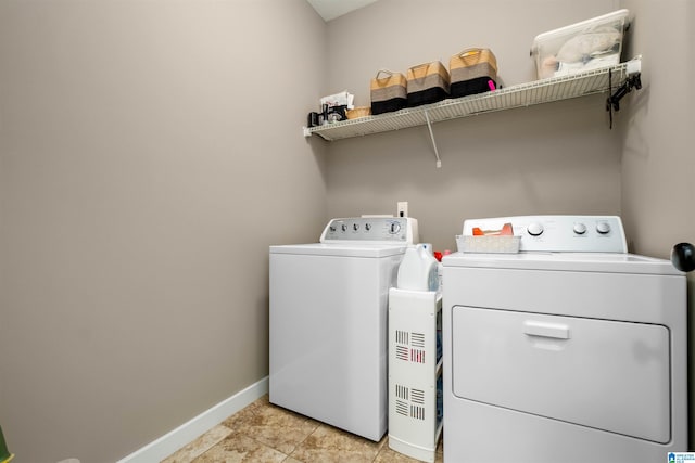 clothes washing area with washer and dryer