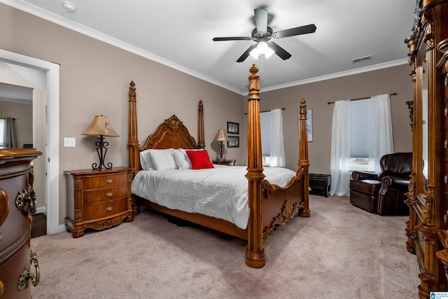 bedroom featuring ceiling fan, crown molding, and carpet