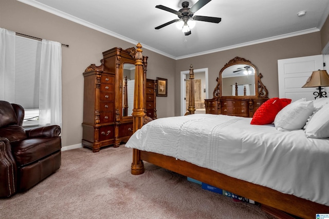 carpeted bedroom featuring ceiling fan, ensuite bathroom, and ornamental molding