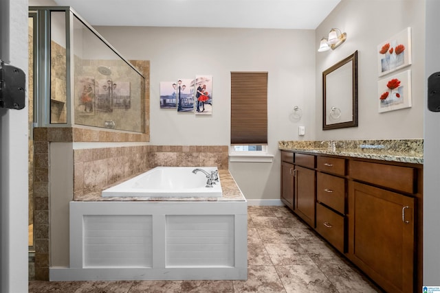 bathroom with separate shower and tub and vanity