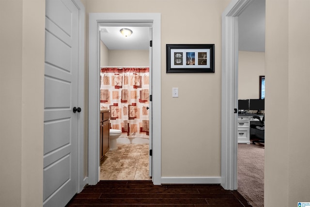 corridor featuring dark hardwood / wood-style floors