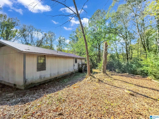 view of property exterior featuring a deck