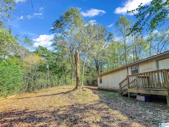 view of yard with a wooden deck