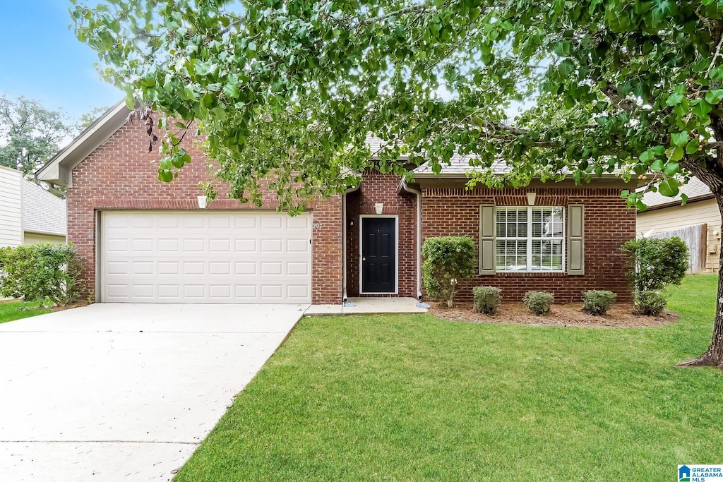 ranch-style house featuring a garage and a front lawn