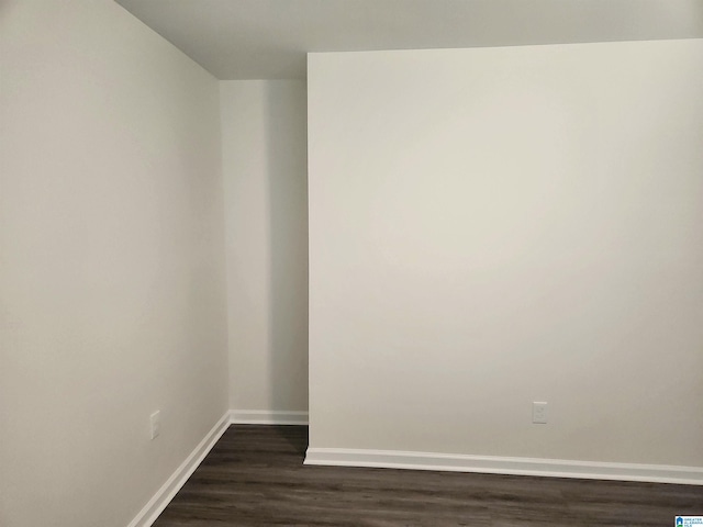 spare room featuring dark hardwood / wood-style floors