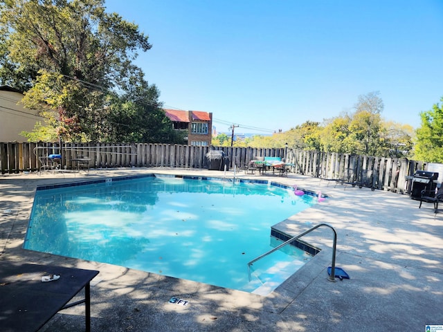 view of swimming pool with a patio