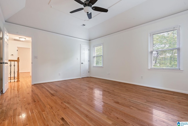 empty room with lofted ceiling, ceiling fan, and light hardwood / wood-style flooring