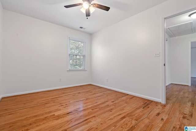 unfurnished room featuring light wood-type flooring and ceiling fan