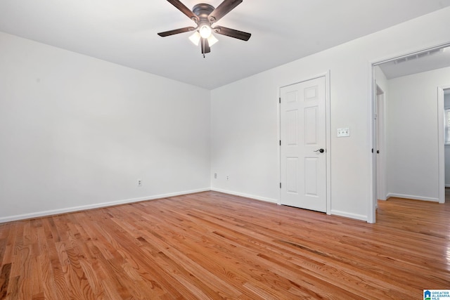 empty room featuring ceiling fan and light wood-type flooring