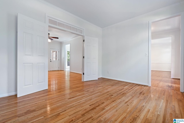 unfurnished room with light hardwood / wood-style floors, ceiling fan, and ornamental molding