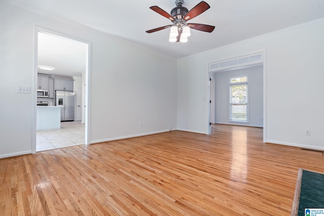 unfurnished living room featuring ornamental molding, light hardwood / wood-style floors, and ceiling fan