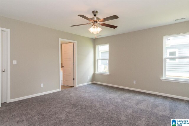 unfurnished room with ceiling fan, plenty of natural light, and carpet flooring