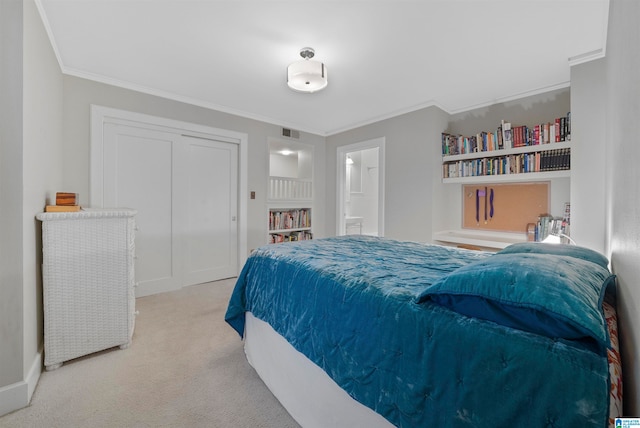 carpeted bedroom featuring connected bathroom, a closet, and crown molding