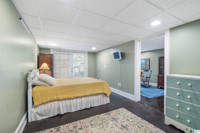 bedroom featuring a drop ceiling