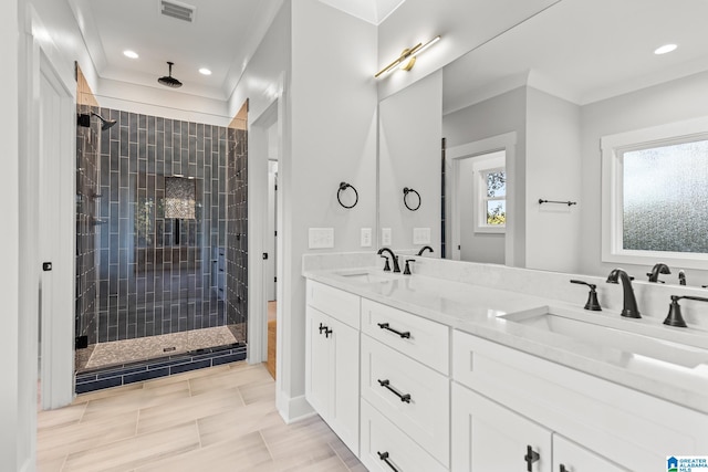 bathroom with tile patterned floors, vanity, and an enclosed shower