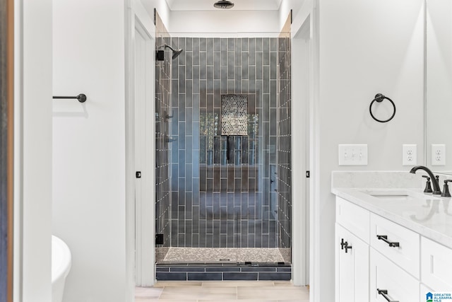 bathroom featuring vanity, tile patterned floors, and a shower with shower door