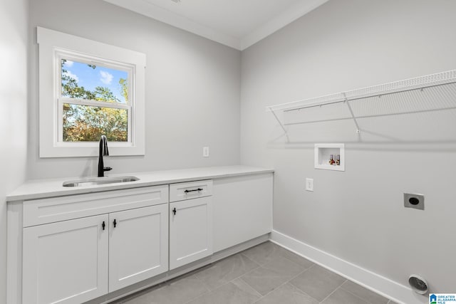 laundry room featuring cabinets, hookup for a washing machine, ornamental molding, electric dryer hookup, and sink