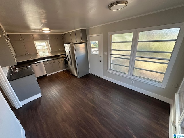 kitchen with gray cabinets, stainless steel appliances, dark hardwood / wood-style floors, and crown molding