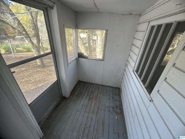 unfurnished sunroom with plenty of natural light