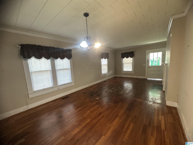 unfurnished dining area with a notable chandelier, dark hardwood / wood-style floors, and crown molding