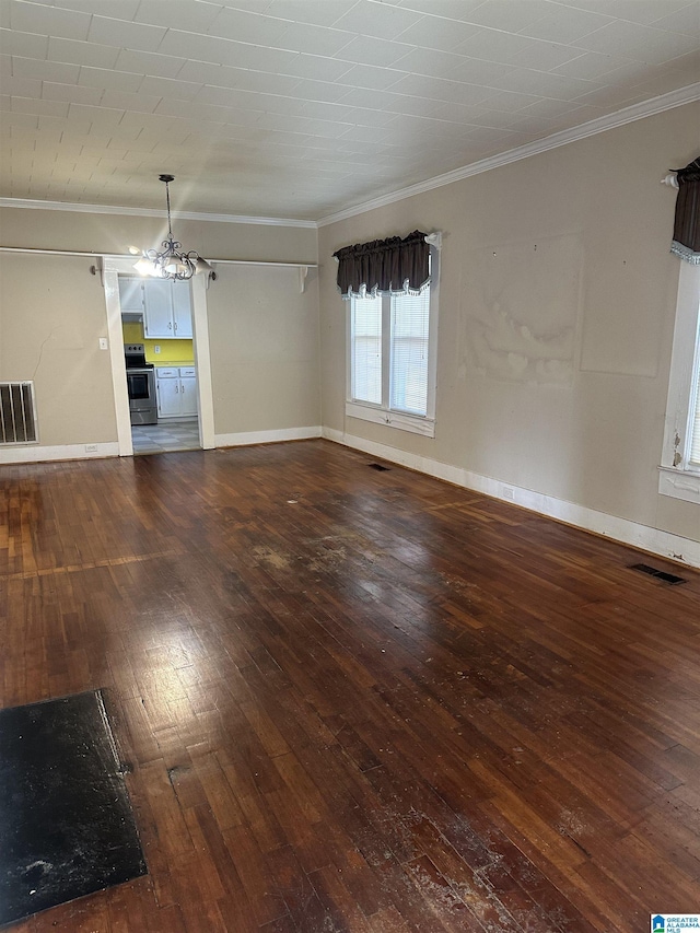 interior space with dark hardwood / wood-style flooring and ornamental molding