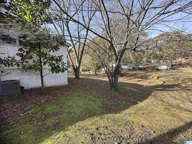 view of yard with central air condition unit