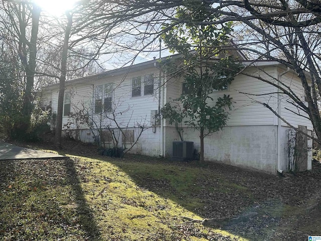 view of property exterior featuring central AC