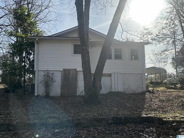 view of property exterior featuring a carport