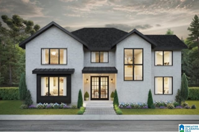 view of front of property featuring a lawn and french doors