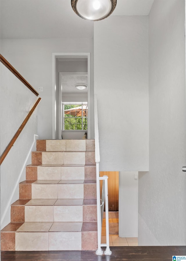 stairway featuring hardwood / wood-style flooring