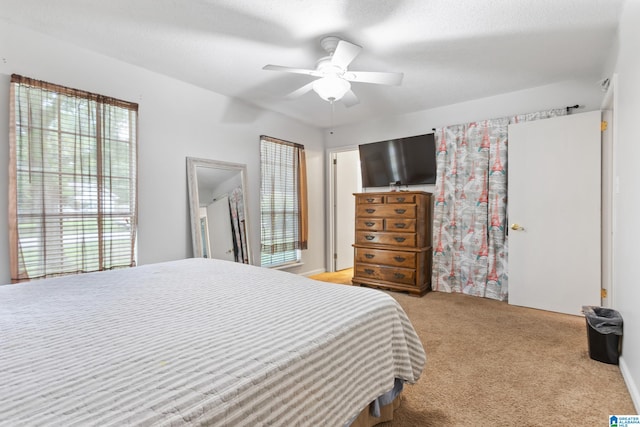 carpeted bedroom featuring ceiling fan