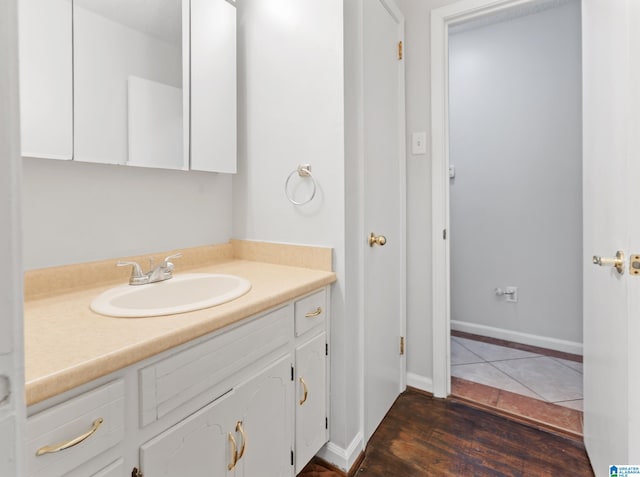 bathroom featuring hardwood / wood-style floors and vanity