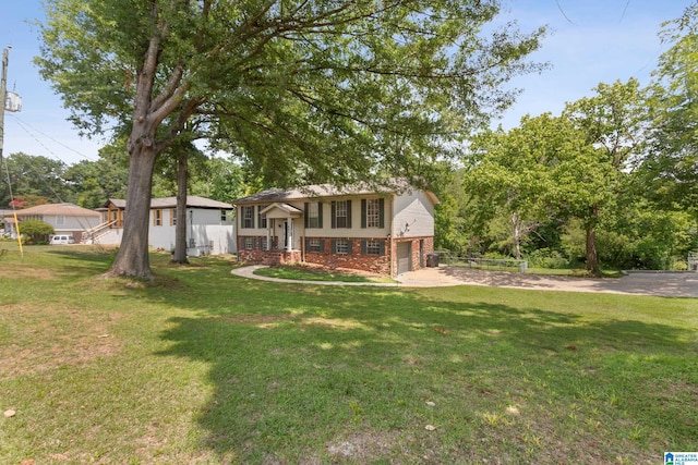 view of front of property with a front lawn and a garage