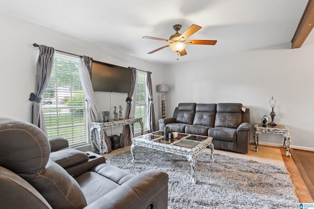 tiled living room featuring a textured ceiling and ceiling fan