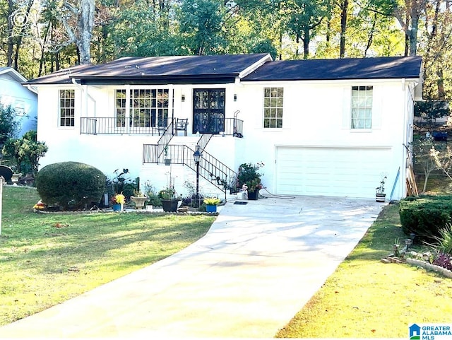 view of front facade with a front lawn and a garage