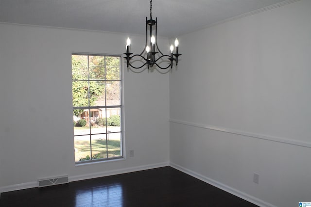 unfurnished dining area with crown molding, plenty of natural light, and dark wood-type flooring