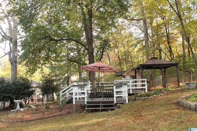 view of yard with a gazebo and a wooden deck