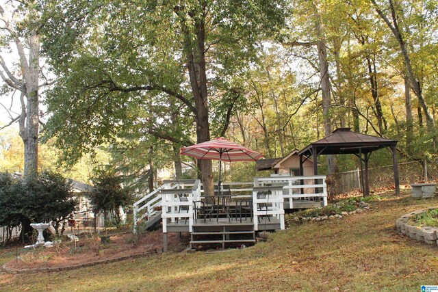view of yard featuring a gazebo and a wooden deck