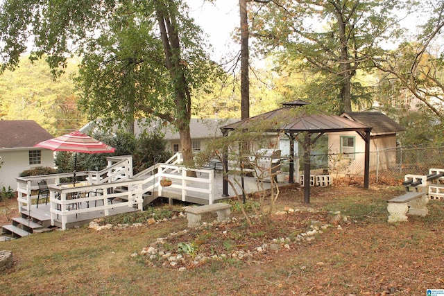 exterior space featuring a gazebo and a wooden deck