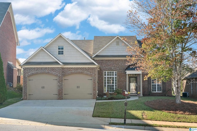 craftsman inspired home featuring central AC, a front lawn, and a garage