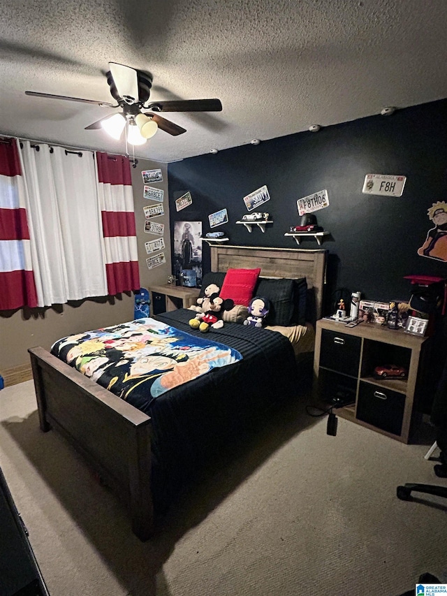 carpeted bedroom featuring a textured ceiling and ceiling fan